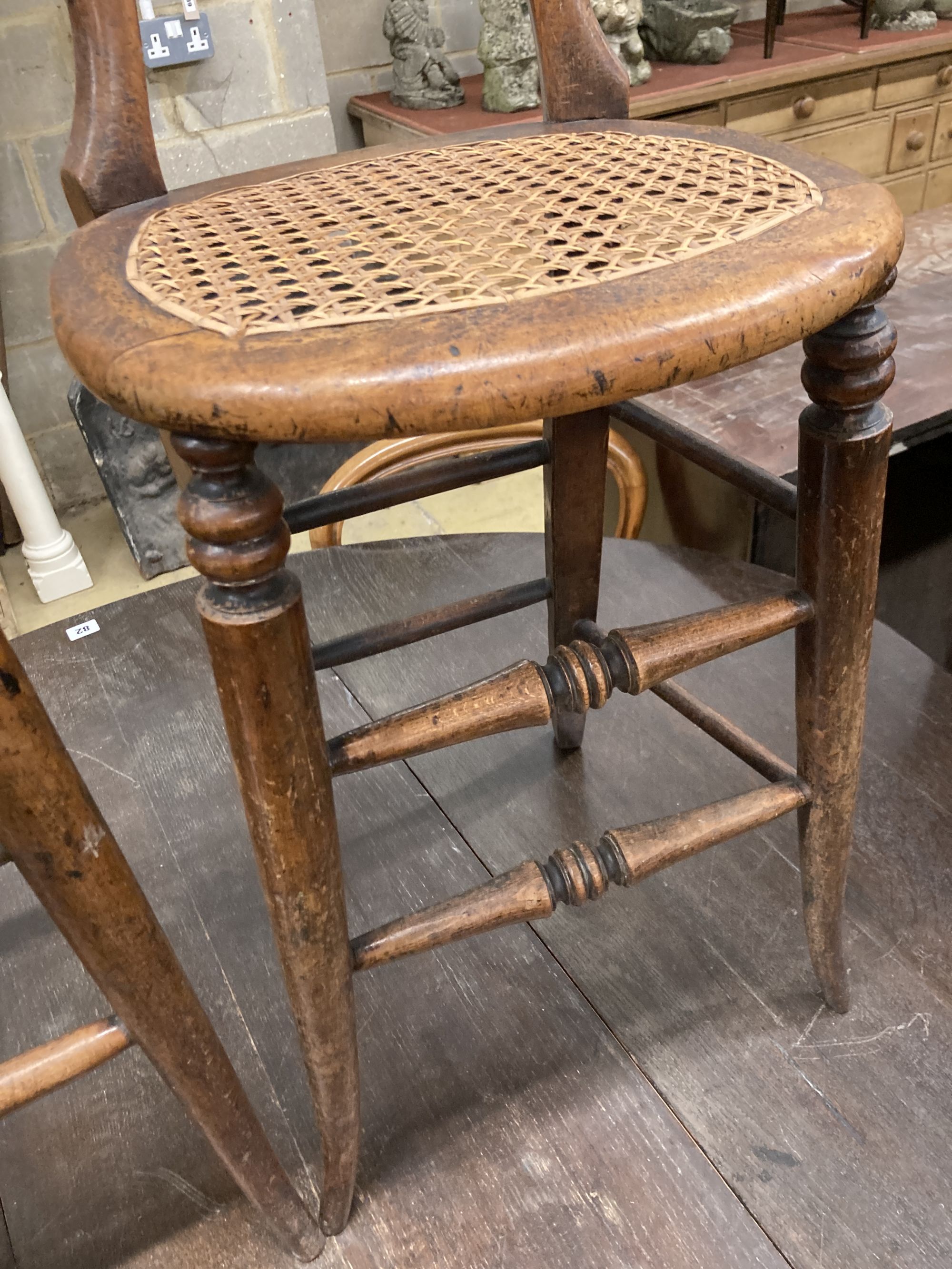 A pair of Victorian spindle back cane seat correction chairs